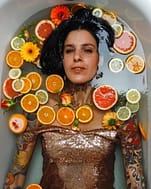 woman surrounded by fruit