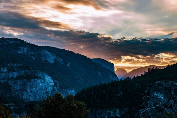 green_trees_on_mountain_under_cloudy_sky-scopio-b8601ba1-dd42-4ea4-81f0-4b2f20a528f7-min mountains landscape