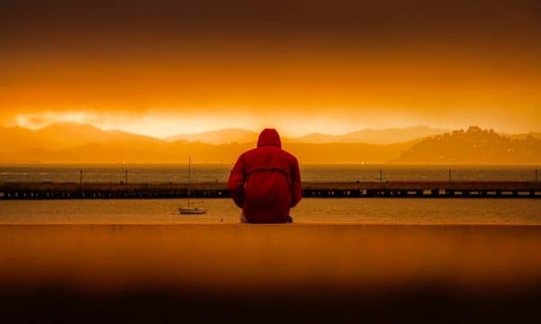 hypnosis depression guy in front of sea