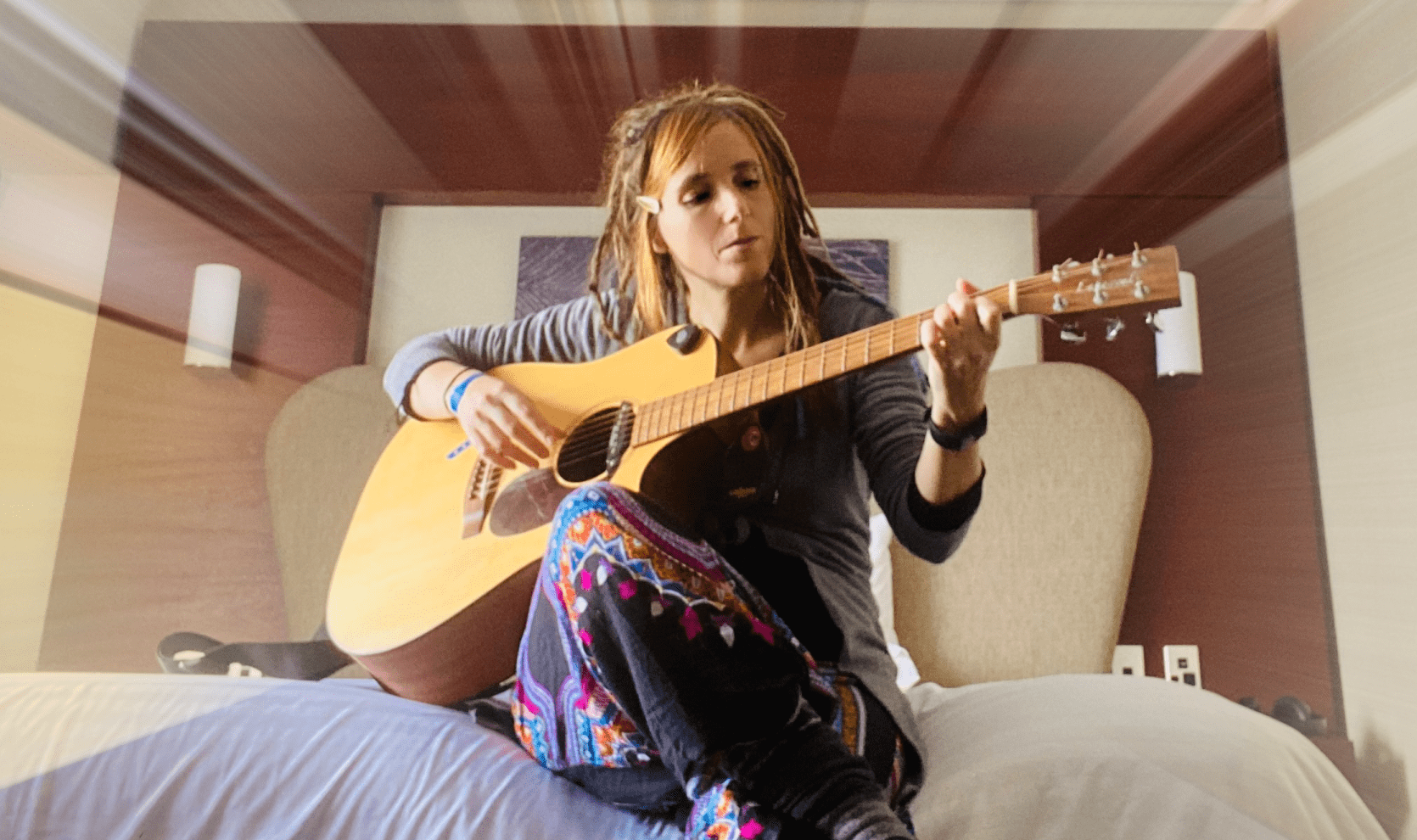 Elyssa Vulpes plays guitar